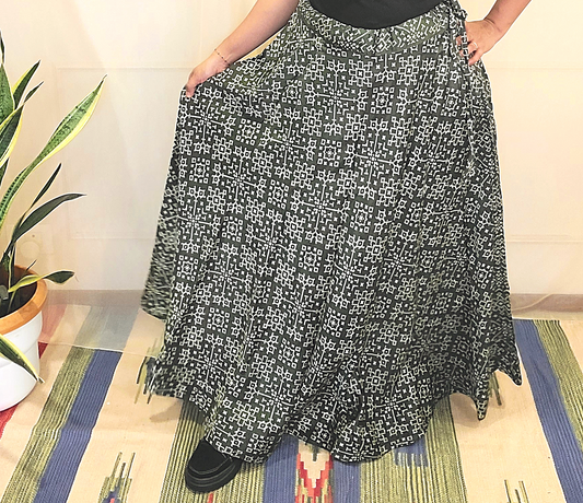 A women wear shiny silk olive green  side string skirt with prints 