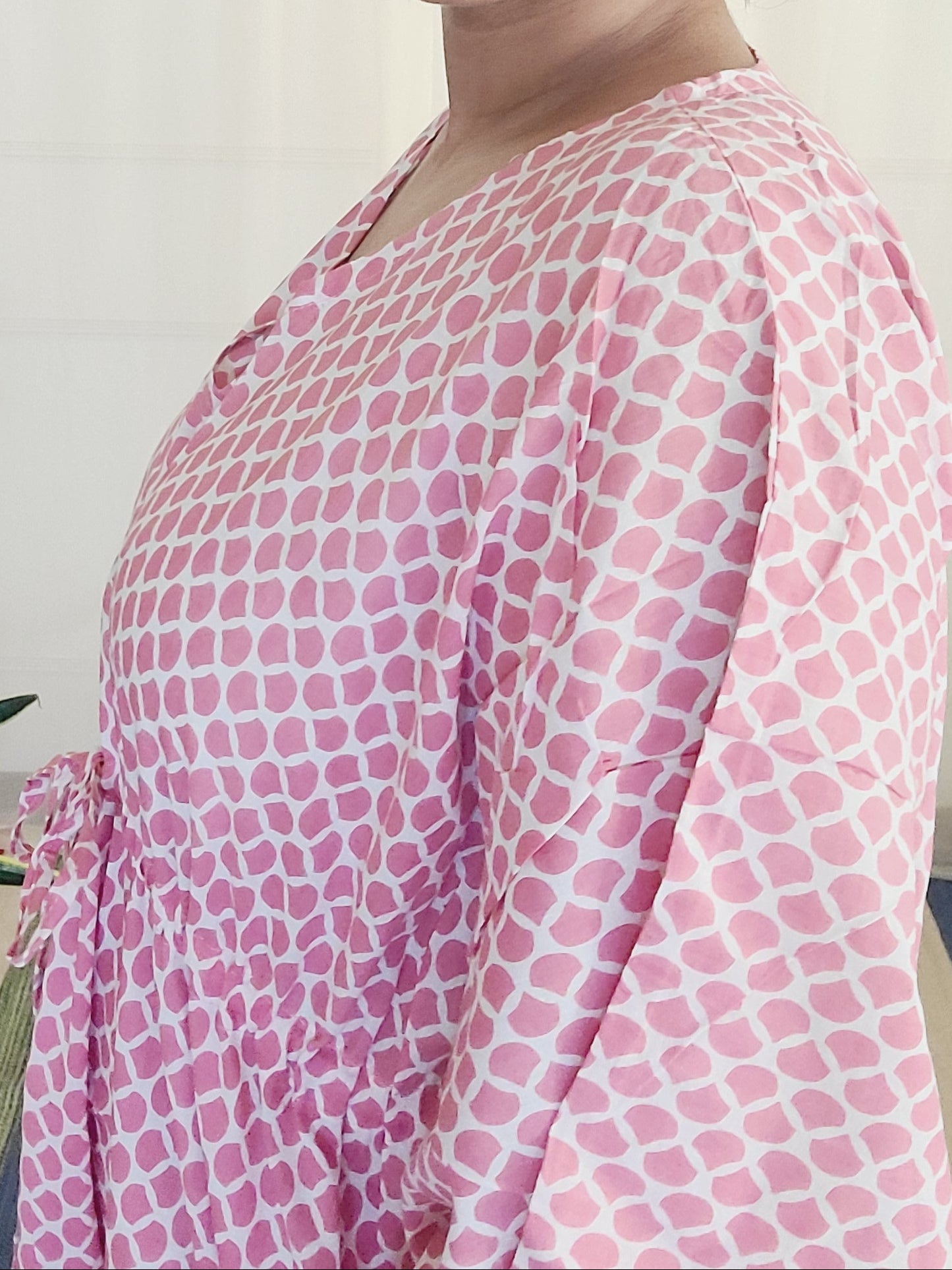 Person wearing a pink patterned  block printed cotton nightwear