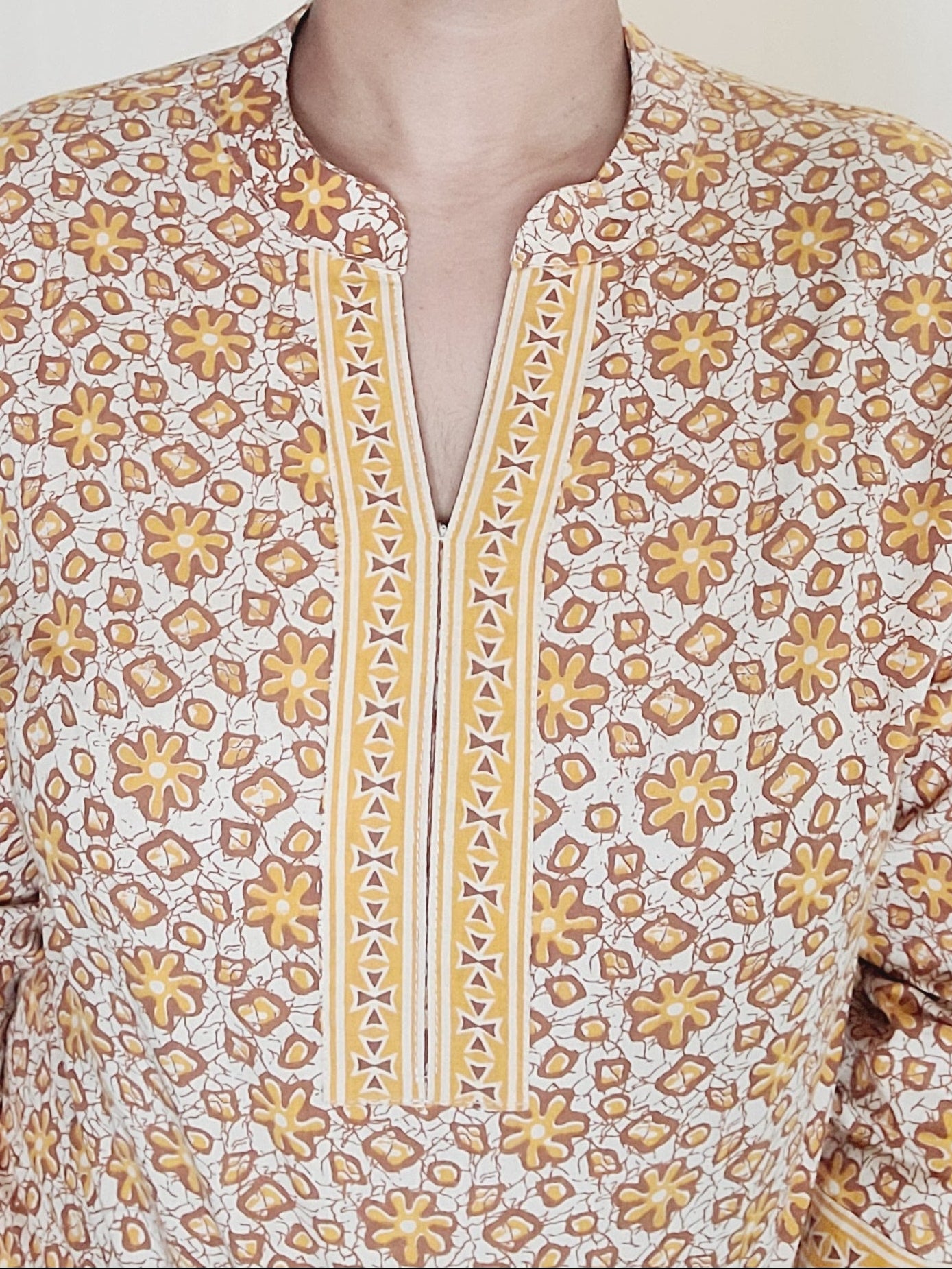 Women wearing a beautiful, mustard yellow short Kurti