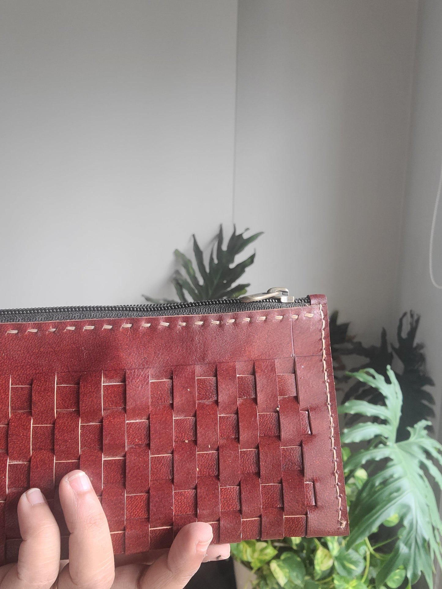 Leather pouch with checks pattern