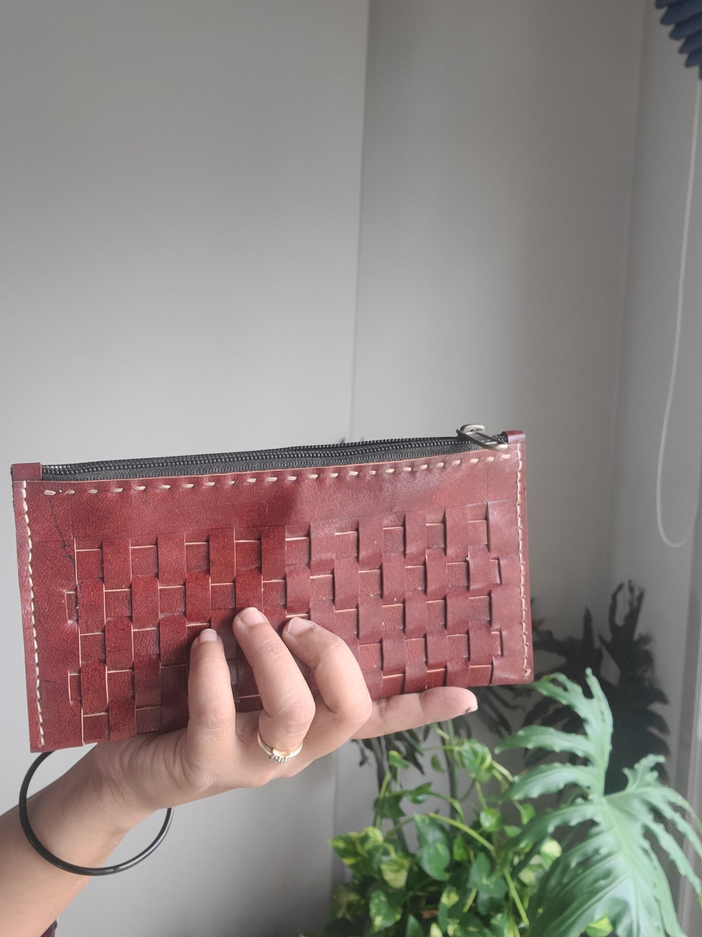 Leather pouch with checks pattern