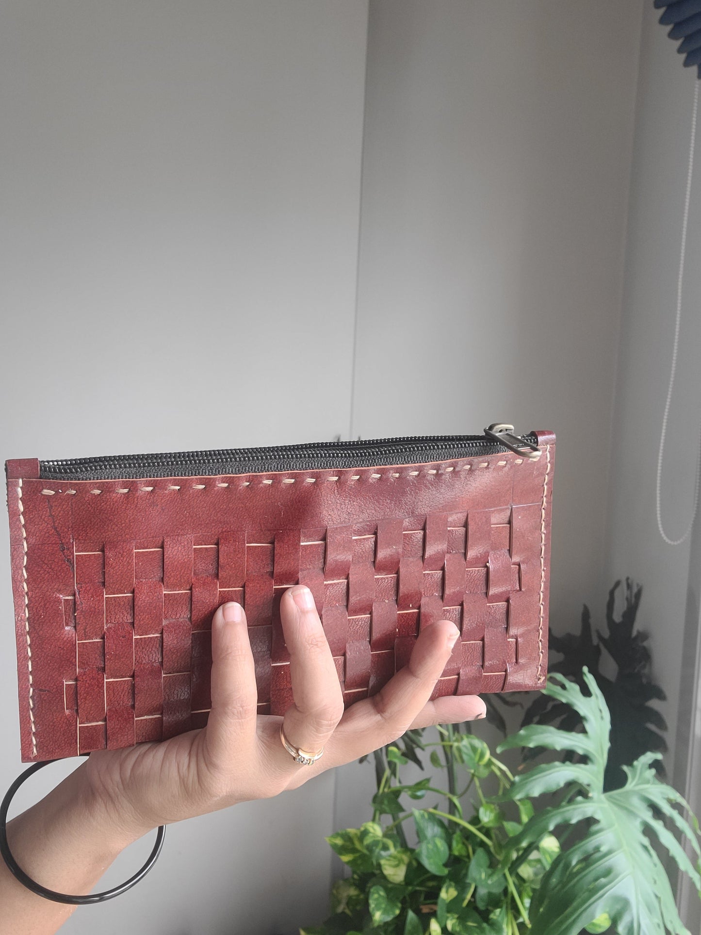 Leather pouch with checks pattern