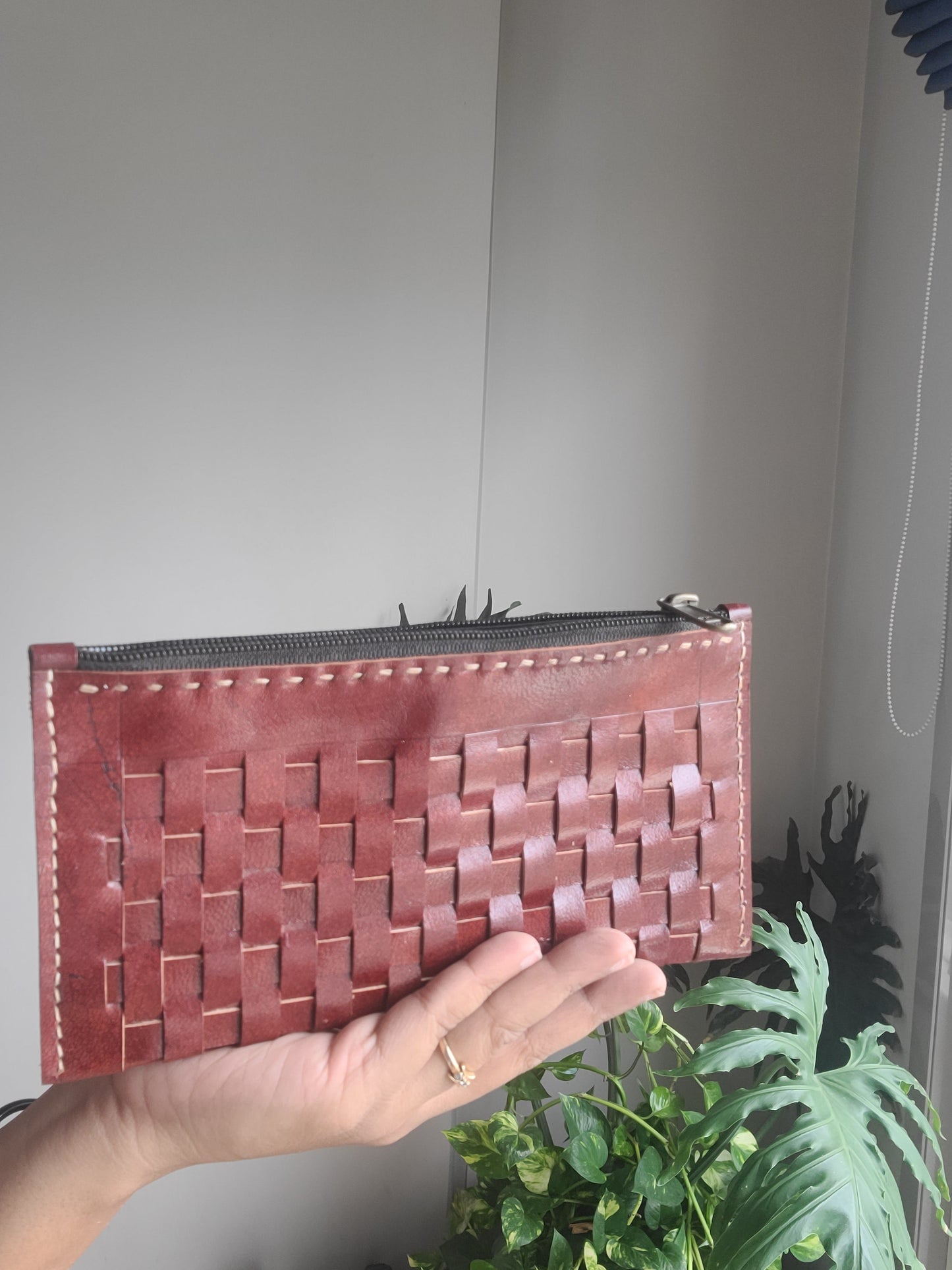 Leather pouch with checks pattern